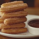 Churros rolled in cinnamon sugar with chocolate dip