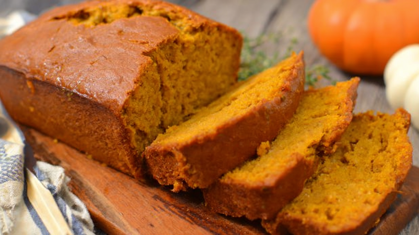 Sliced pumpkin bread on a cutting board