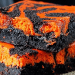 Halloween cream cheese swirl brownies with orange and black swirls