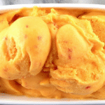 Bowl of Homemade Peach Sorbet with Mint