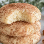 Cinnamon cream cheese cookies on a plate with powdered sugar