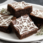 Spider Web Halloween Brownies in a decorated spooky setting