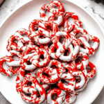 Halloween pretzels with festive toppings on a dark background