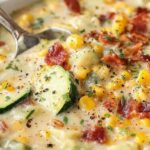 Creamy summer corn and zucchini chowder in a rustic bowl