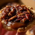 Freshly baked Crumbl Pecan Pie Cookies with pecans and a golden crust