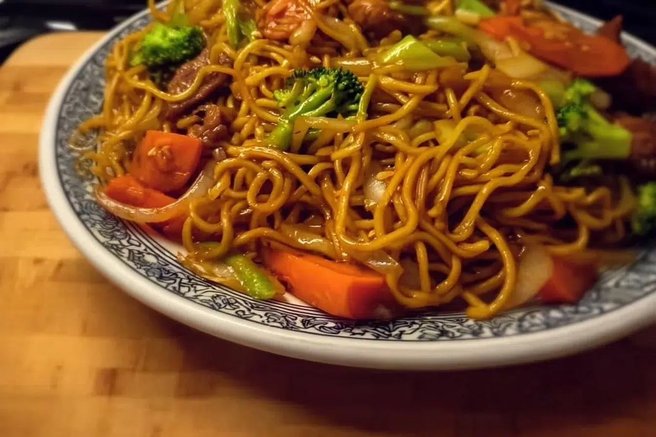 Bowl of easy Lo Mein noodles with colorful vegetables and sauce.