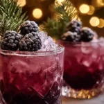 Frosted Blackberry Mule holiday mocktail with blackberries and mint garnish