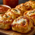 Delicious flaky mozzarella pizza rolls loaded with melted cheese.