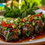 Delicious Thai Basil Beef Rolls served on a plate with fresh herbs.