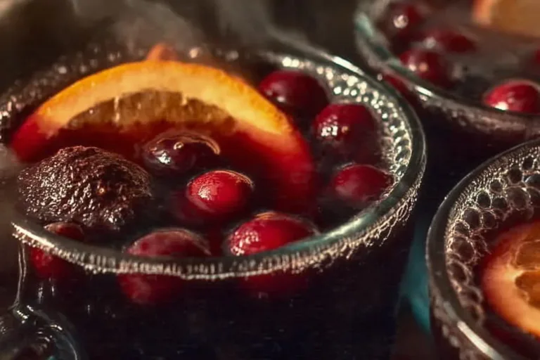 A cozy mug of mulled wine with spices and citrus fruits