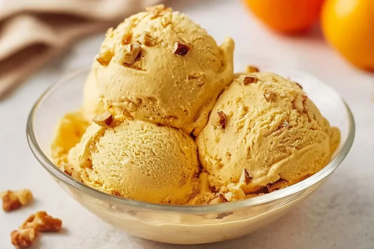 No-churn pumpkin pie ice cream topped with whipped cream and pumpkin spice