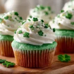 Delicious green velvet cupcakes on a decorative plate