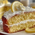 Delicious Limoncello Ricotta Cake decorated with fresh lemon slices and mint.