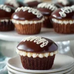 Homemade Hostess Cupcakes drizzled with chocolate and filled with cream.
