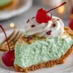 Delicious Shamrock Shake Pie with green whipped cream and mint garnish