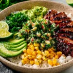 Delicious Street Corn Chicken Rice Bowl with grilled chicken and toppings