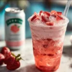 Healthy pink drink made with fresh fruits and coconut milk