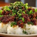Delicious Korean Ground Beef Bowl garnished with green onions and sesame seeds.