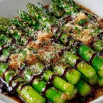 Fresh and flavorful asparagus cooked to perfection on a white plate