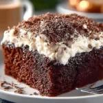 Decadent Bailey's Irish Cream Chocolate Cake topped with creamy frosting and chocolate shavings