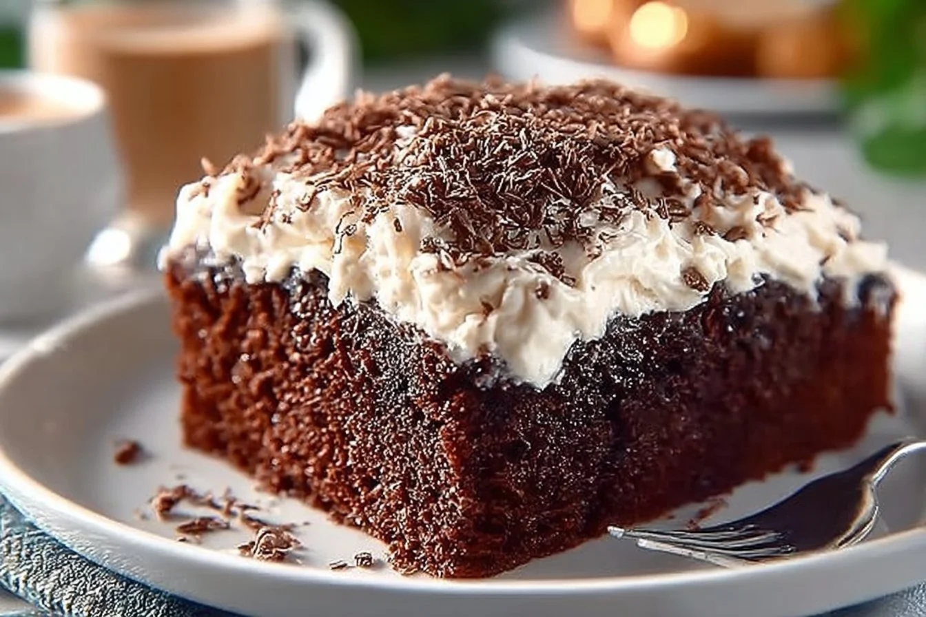 Decadent Bailey's Irish Cream Chocolate Cake topped with creamy frosting and chocolate shavings
