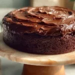 Delicious homemade Chocolate Fudge Cake decorated with chocolate ganache