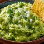 Delicious bowl of fresh guacamole made using the best guacamole recipe.