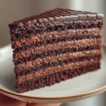 Triple Chocolate Layer Cake showcasing rich layers of chocolate cake and frosting.
